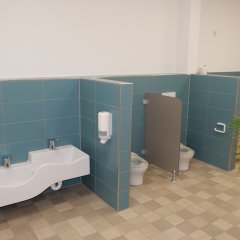 Auf dem Foto ist der ansprechende Sanitärbereich der Krippenkinder samt Wickeltisch zu sehen.