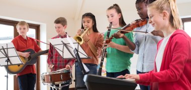 High School Students Playing In School Orchestra Together