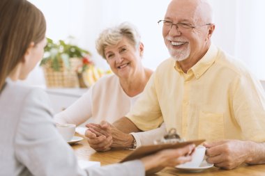 Smiling elder married couple