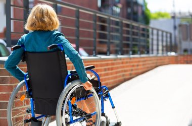 woman on wheelchair entering the platform