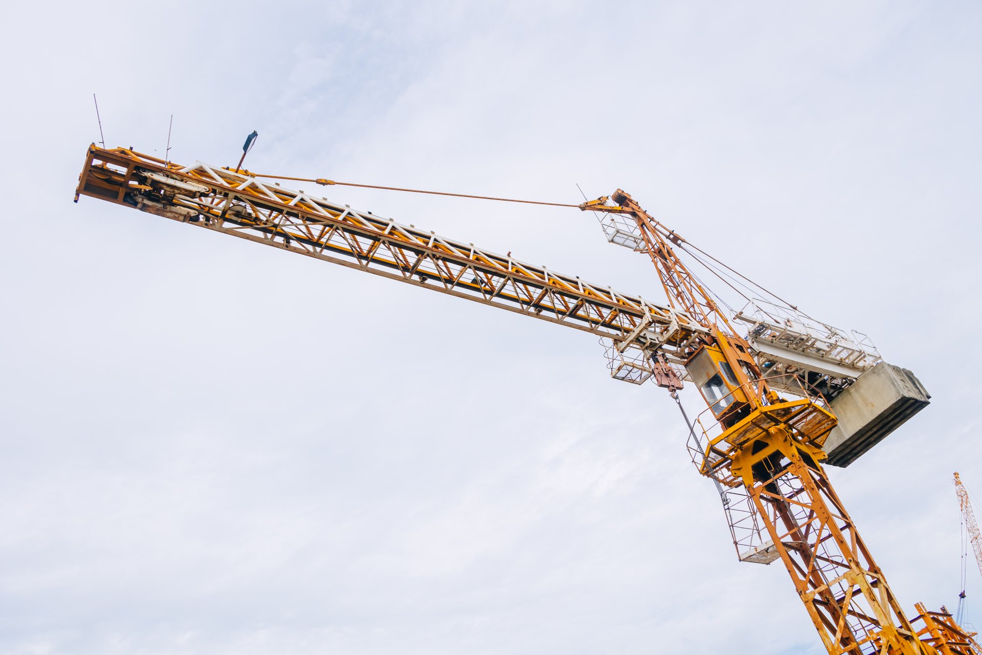 Tower Crane At Construction Site Outdoor. City Urban Development An Crane Do Lifting To Built To Infrastructure.